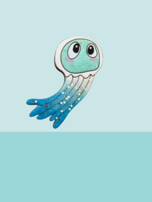 Laissez-vous envoûter par cette adorable broche méduse bleue pailletée, un bijou unique qui allie douceur et éclat.