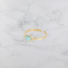 Découvrez la bague ovale en pierre amazonite - élégance naturelle et raffinement authentique en acier doré pour femme